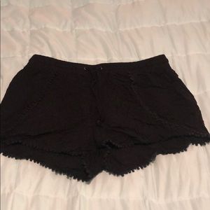 Black shorts with tassel detail